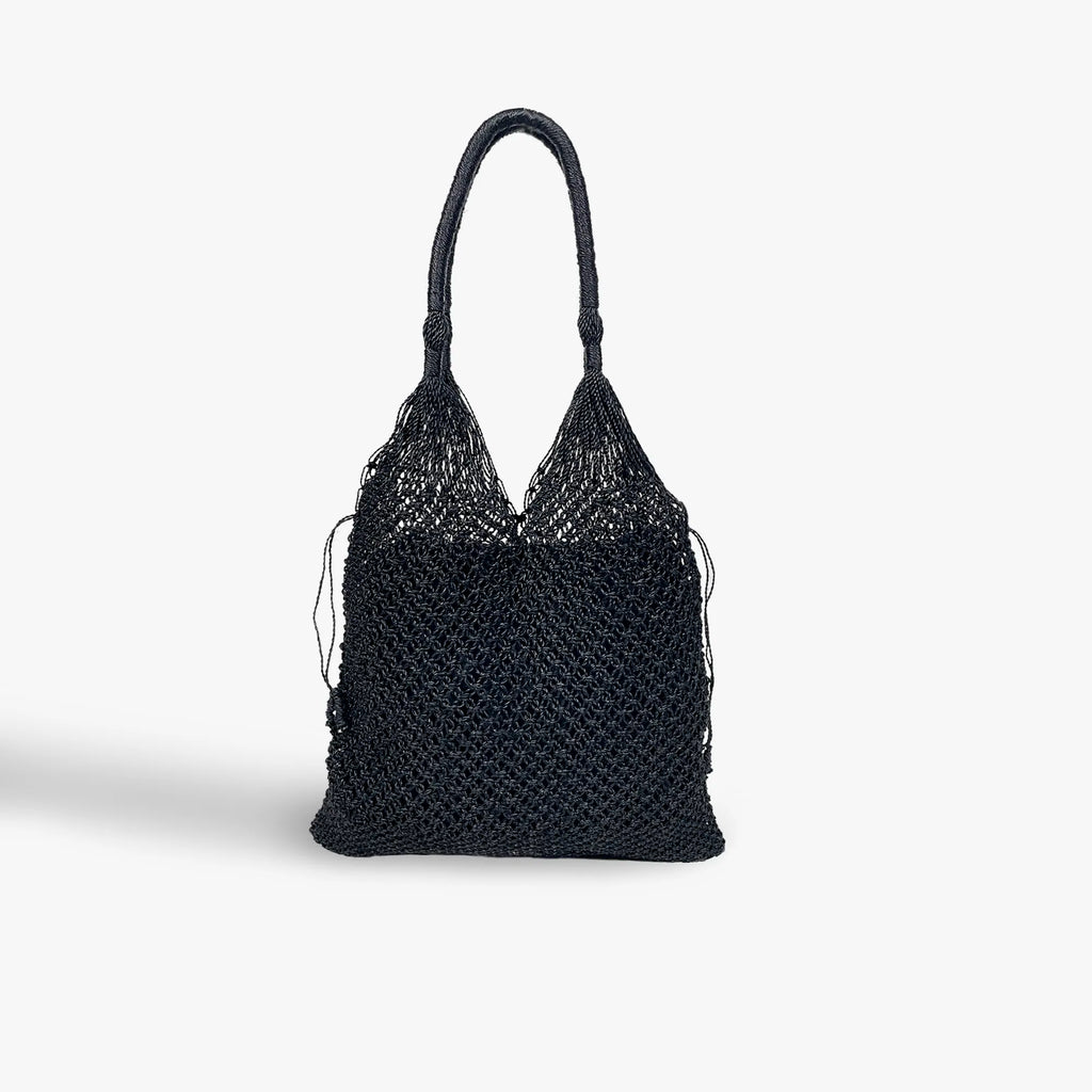 Black woven handbag on a white background