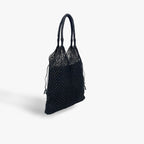 Black woven handbag on a light gray background