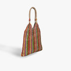 Multicolored striped handbag with a handle on a white background