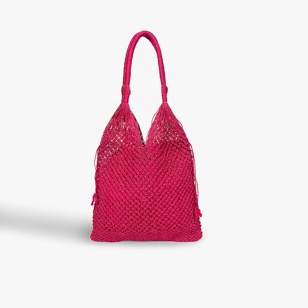 Pink woven handbag on a light gray background