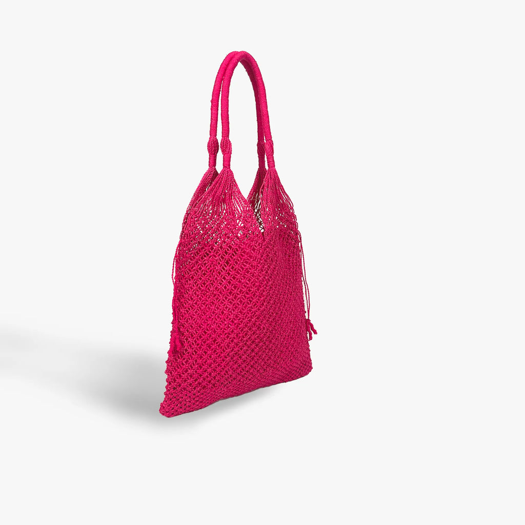 Pink woven handbag on a light gray background