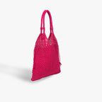 Pink woven handbag on a light gray background