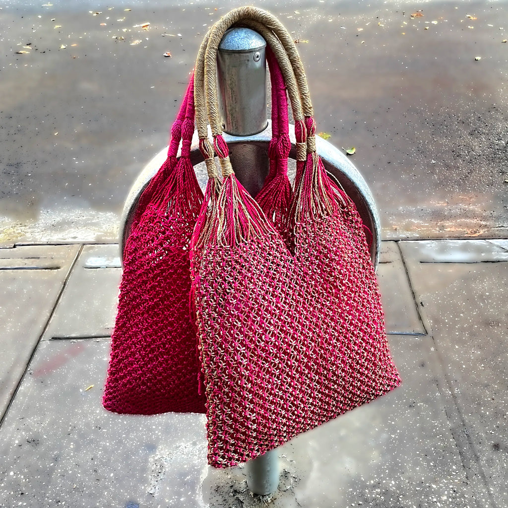 Red woven bags on a mannequin against a concrete background