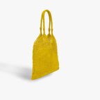 Yellow woven handbag on a light gray background
