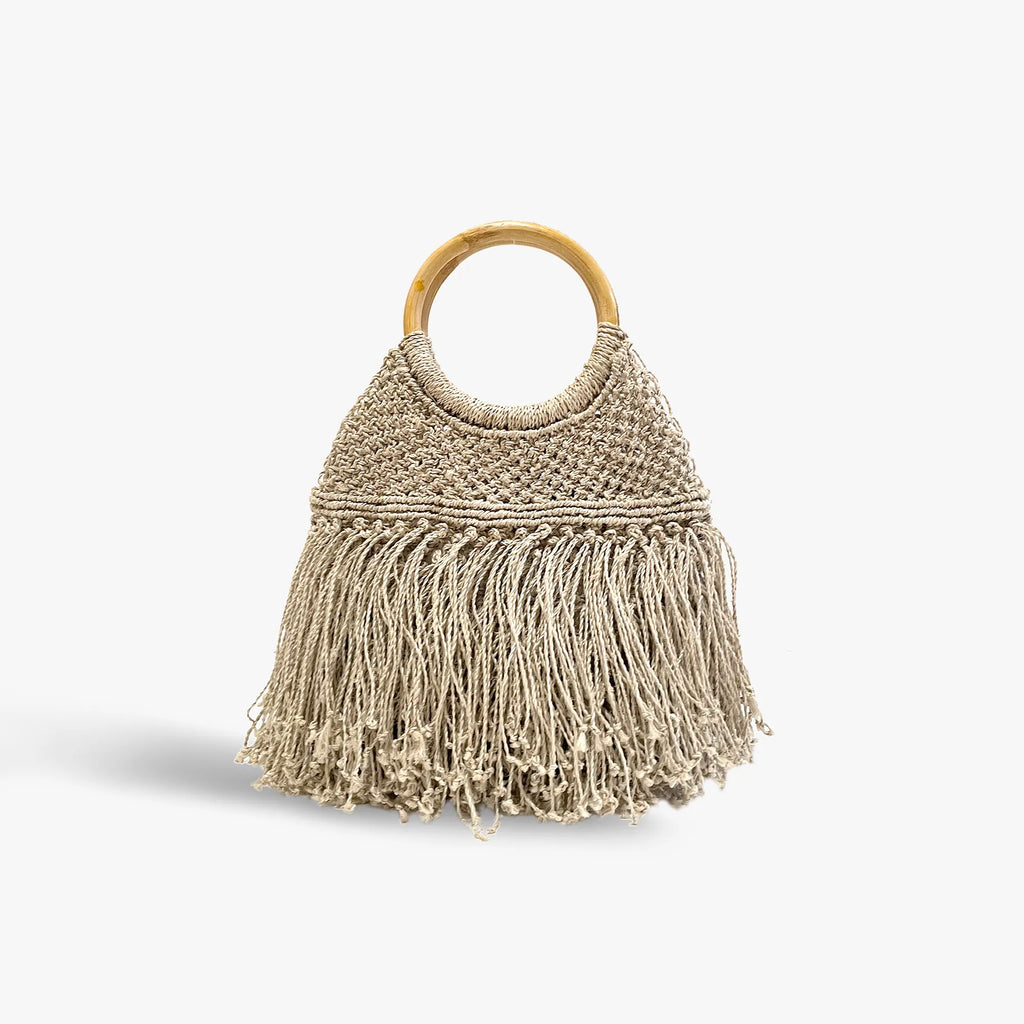Beige handbag with fringe and wooden handle on a white background