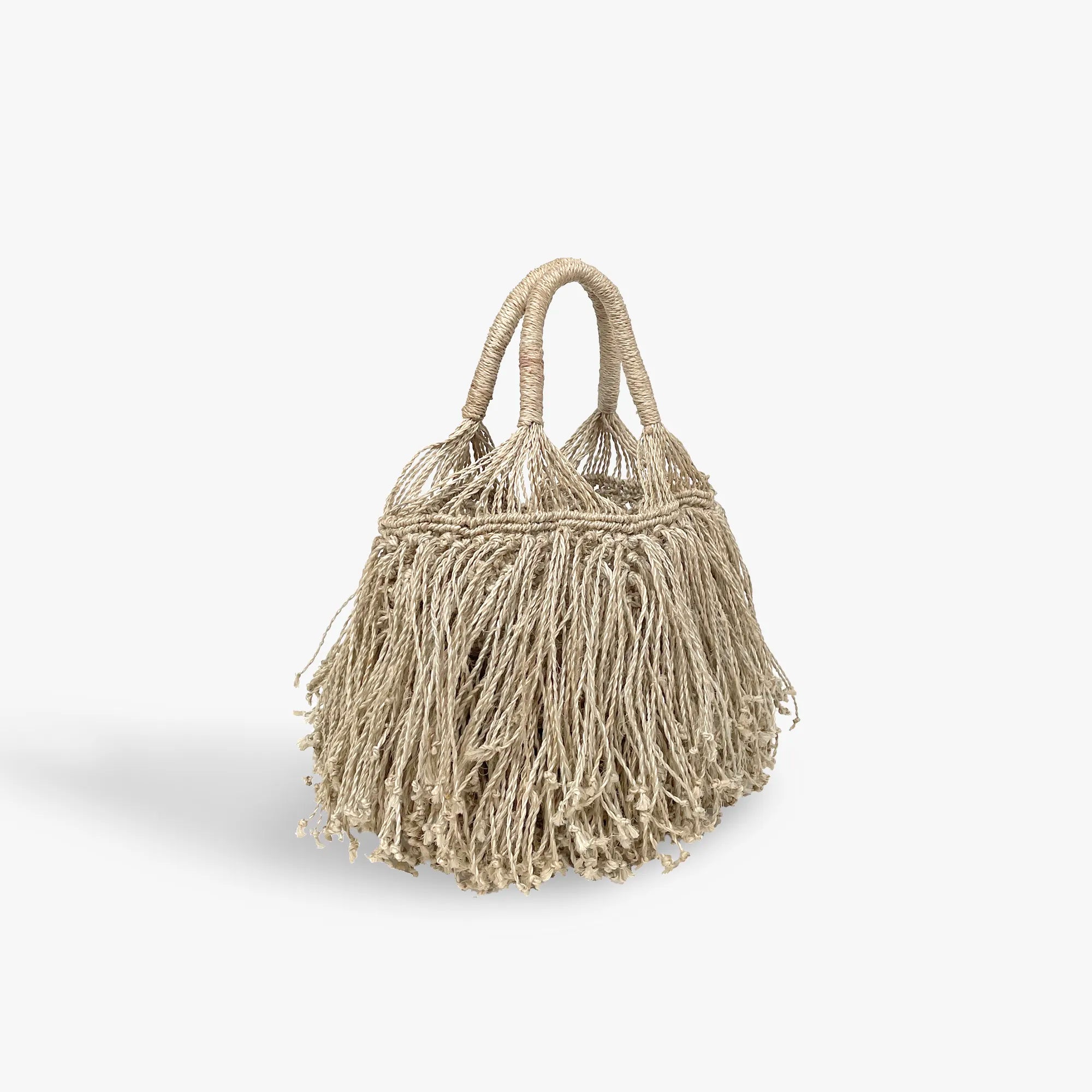 Beige woven handbag with fringe details on a white background