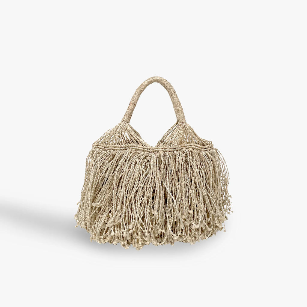 Beige handbag with fringe details on a white background